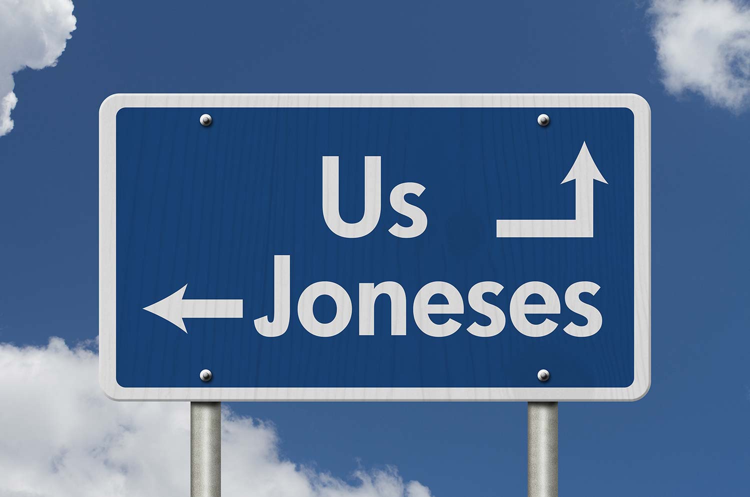 A road sign with arrows pointing to us and to the joneses